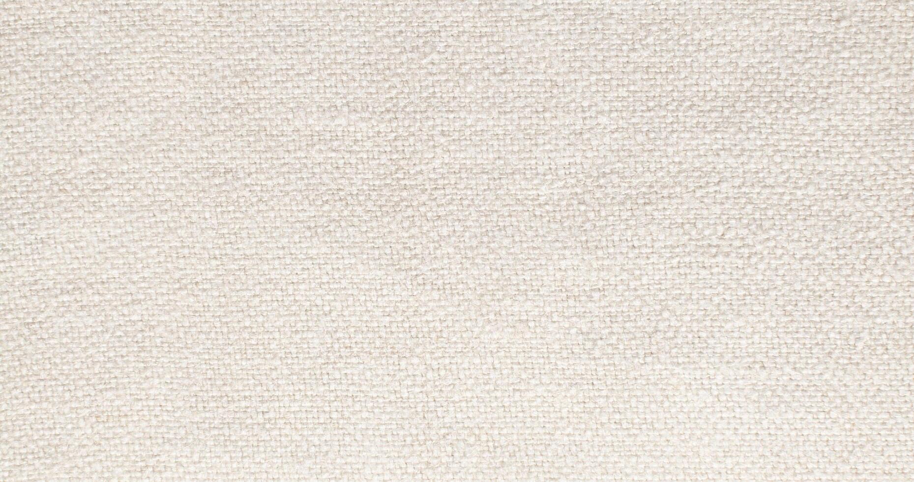 Natural Linen Material Textile Canvas Fabric Texture Background Close-up Detail of Fabric Natural Color Hemp Material Pattern Design Wallpaper. Can be Used as Background or For Graphic Design photo