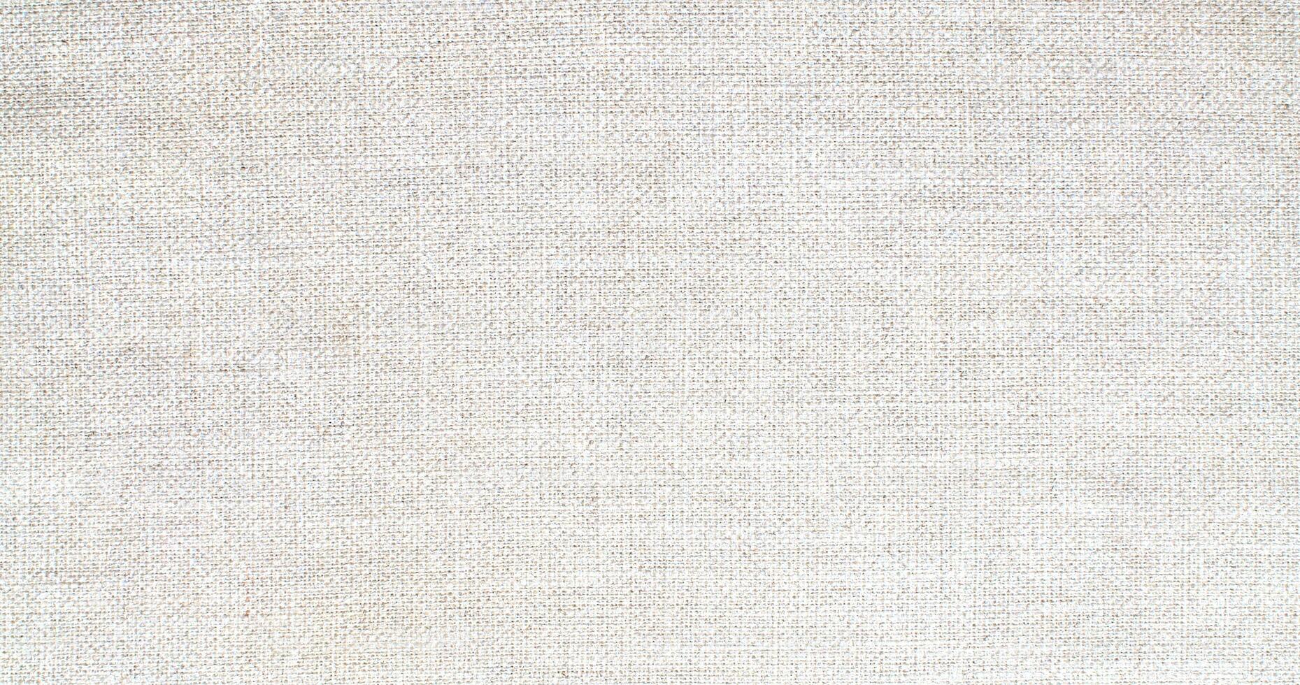 Natural Linen Material Textile Canvas Fabric Texture Background Close-up Detail of Fabric Natural Color Hemp Material Pattern Design Wallpaper. Can be Used as Background or For Graphic Design photo