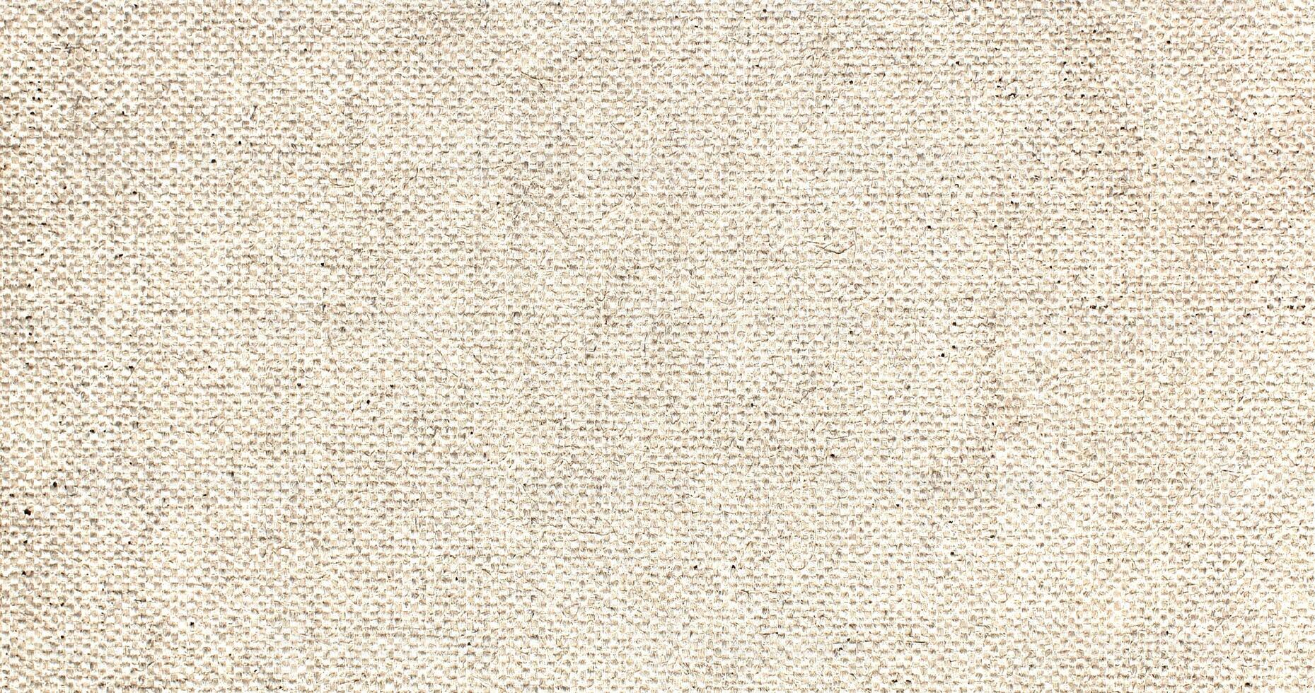 Natural Linen Material Textile Canvas Fabric Texture Background Close-up Detail of Fabric Natural Color Hemp Material Pattern Design Wallpaper. Can be Used as Background or For Graphic Design photo