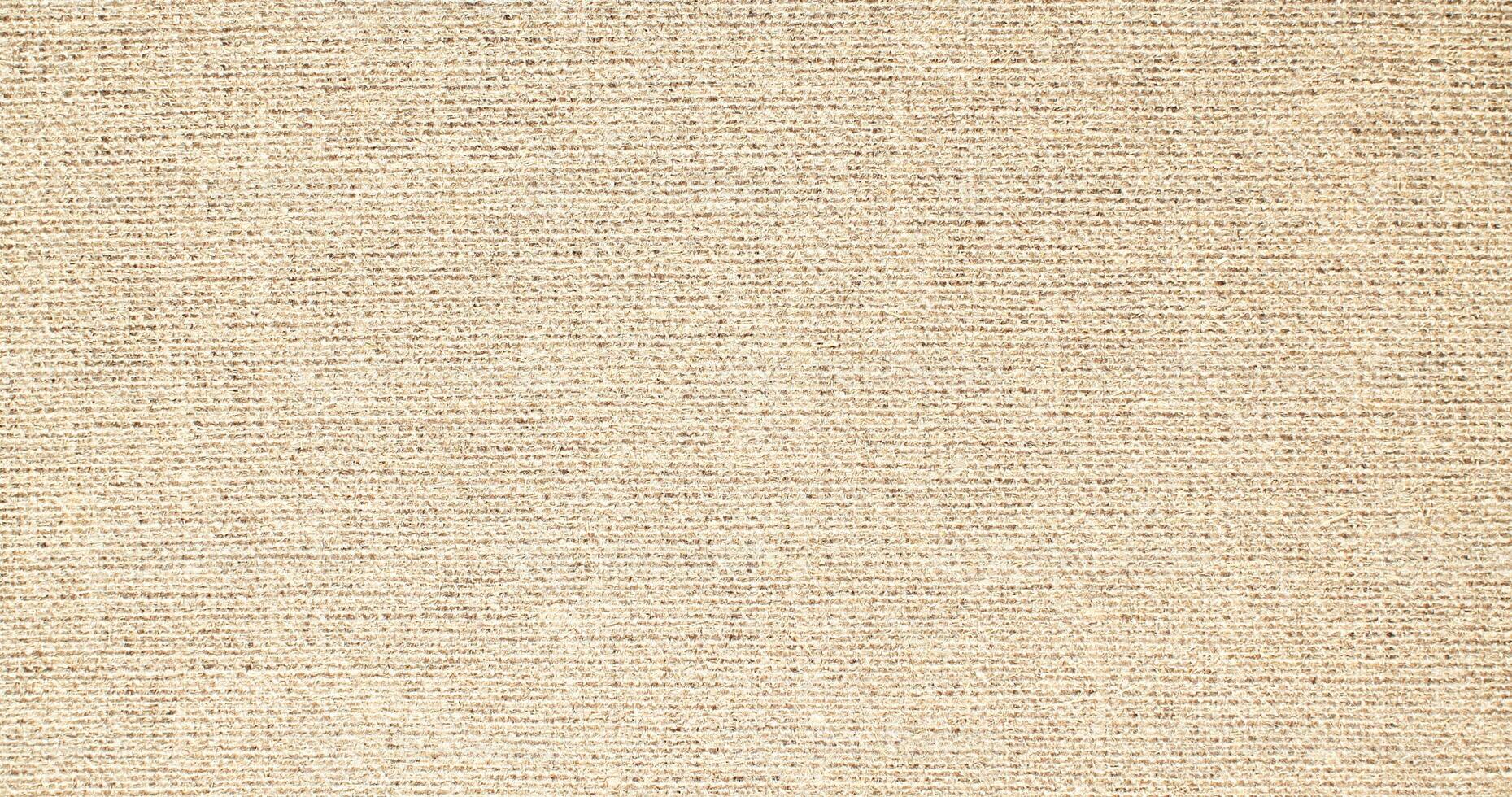 Natural Linen Material Textile Canvas Fabric Texture Background Close-up Detail of Fabric Natural Color Hemp Material Pattern Design Wallpaper. Can be Used as Background or For Graphic Design photo