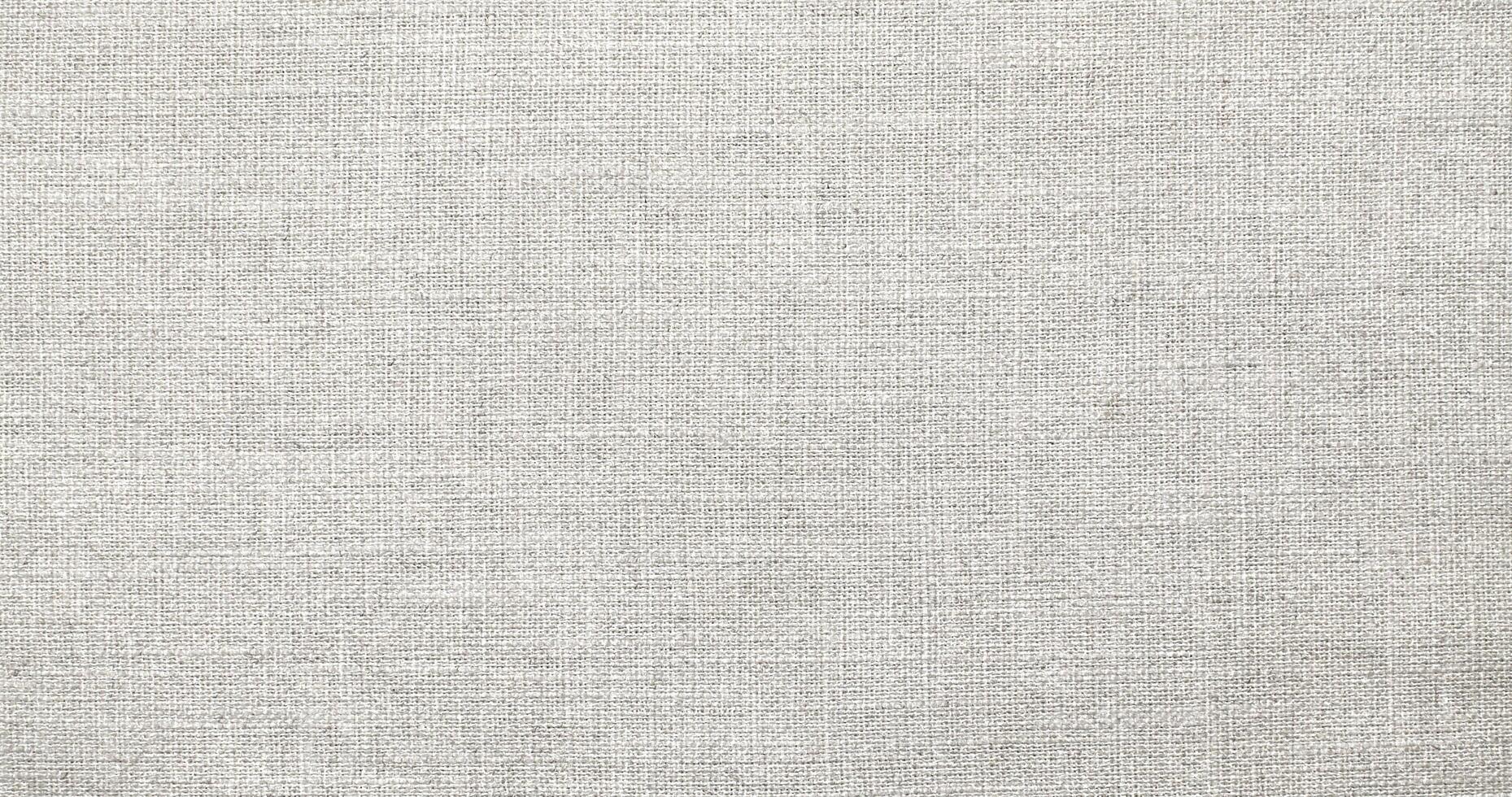 Natural Linen Material Textile Canvas Fabric Texture Background Close-up Detail of Fabric Natural Color Hemp Material Pattern Design Wallpaper. Can be Used as Background or For Graphic Design photo