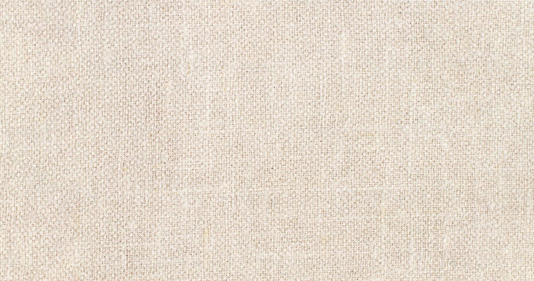 Natural Linen Material Textile Canvas Fabric Texture Background Close-up Detail of Fabric Natural Color Hemp Material Pattern Design Wallpaper. Can be Used as Background or For Graphic Design photo