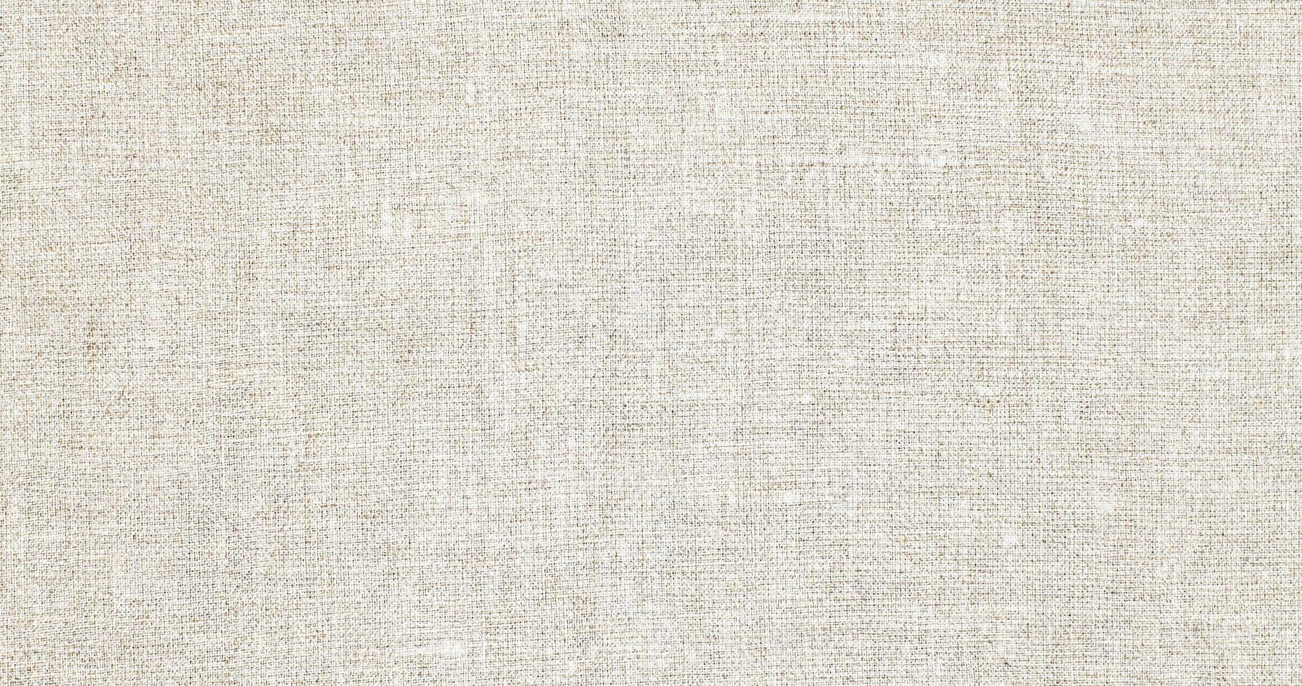 Natural Linen Material Textile Canvas Fabric Texture Background Close-up Detail of Fabric Natural Color Hemp Material Pattern Design Wallpaper. Can be Used as Background or For Graphic Design photo