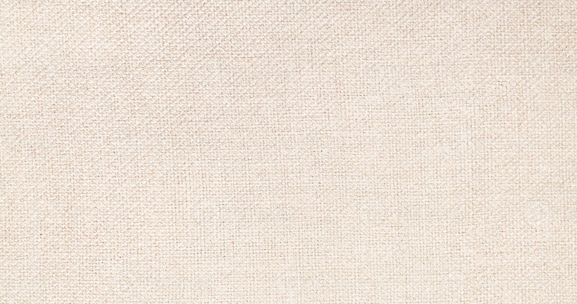 Natural Linen Material Textile Canvas Fabric Texture Background Close-up Detail of Fabric Natural Color Hemp Material Pattern Design Wallpaper. Can be Used as Background or For Graphic Design photo