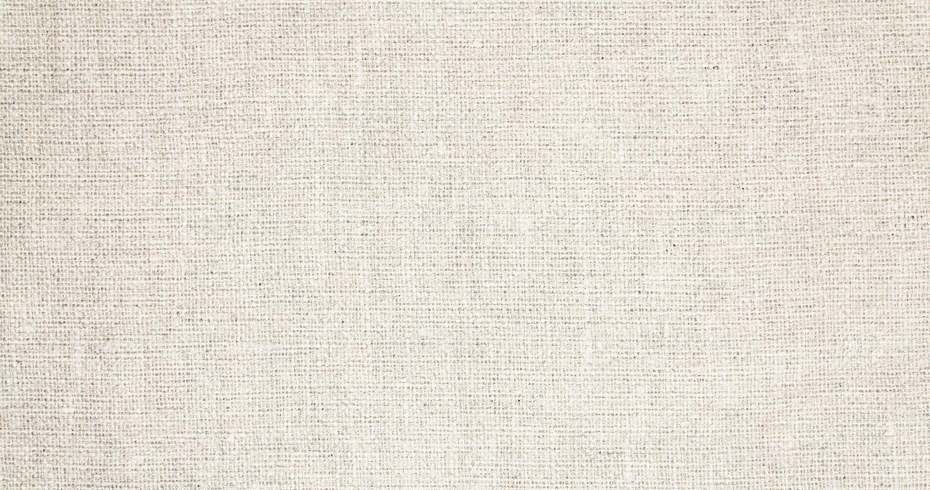 Natural Linen Material Textile Canvas Fabric Texture Background Close-up Detail of Fabric Natural Color Hemp Material Pattern Design Wallpaper. Can be Used as Background or For Graphic Design photo