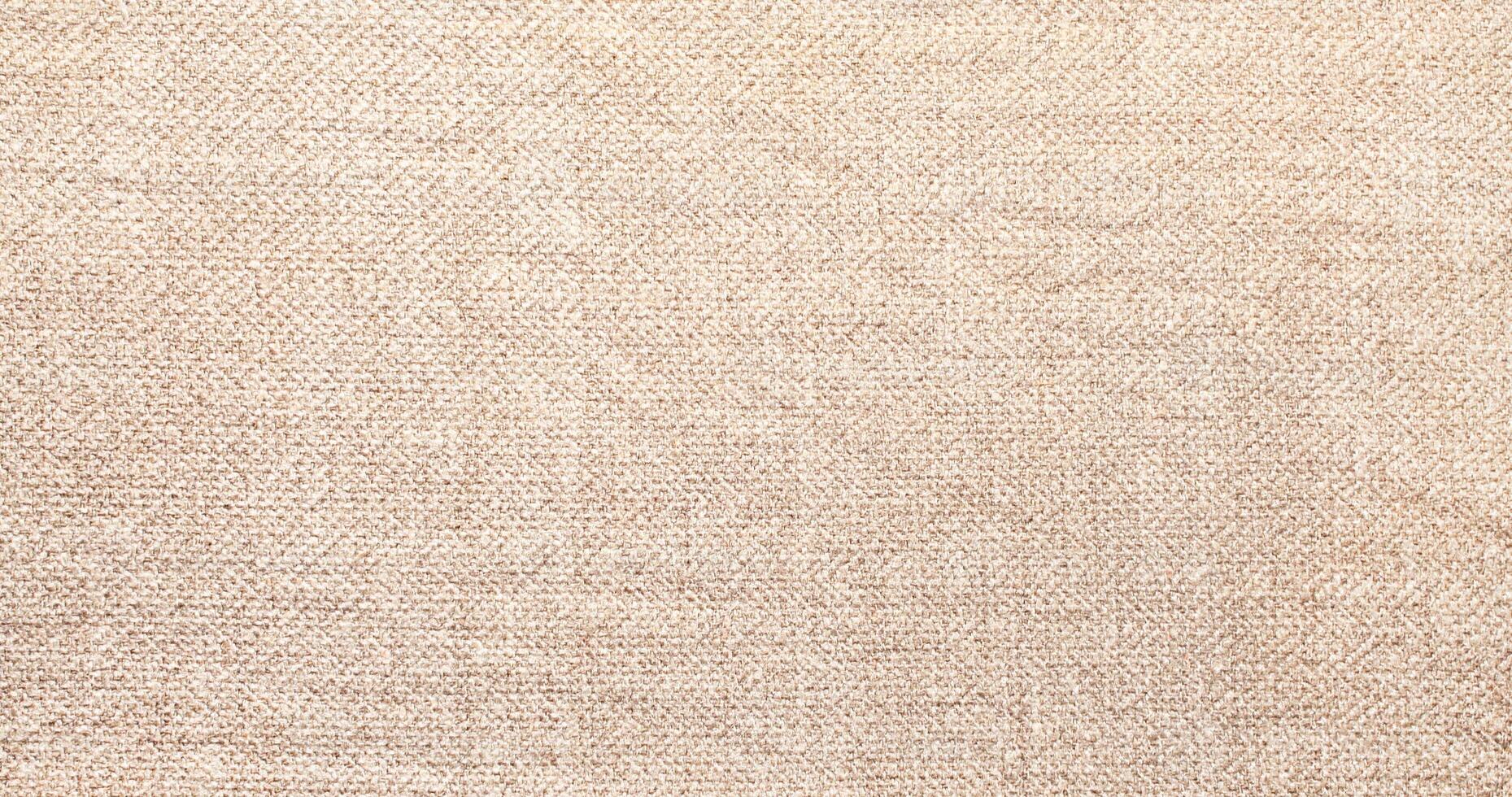 Natural Linen Material Textile Canvas Fabric Texture Background Close-up Detail of Fabric Natural Color Hemp Material Pattern Design Wallpaper. Can be Used as Background or For Graphic Design photo