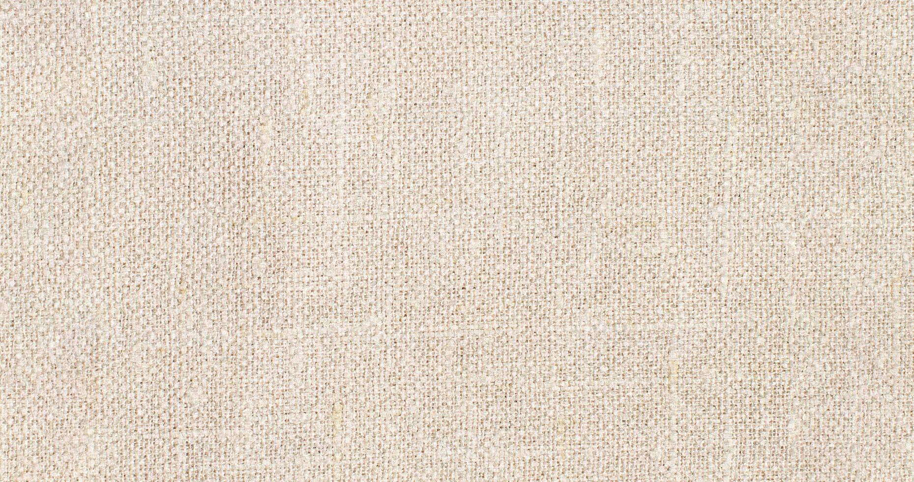 Natural Linen Material Textile Canvas Fabric Texture Background Close-up Detail of Fabric Natural Color Hemp Material Pattern Design Wallpaper. Can be Used as Background or For Graphic Design photo
