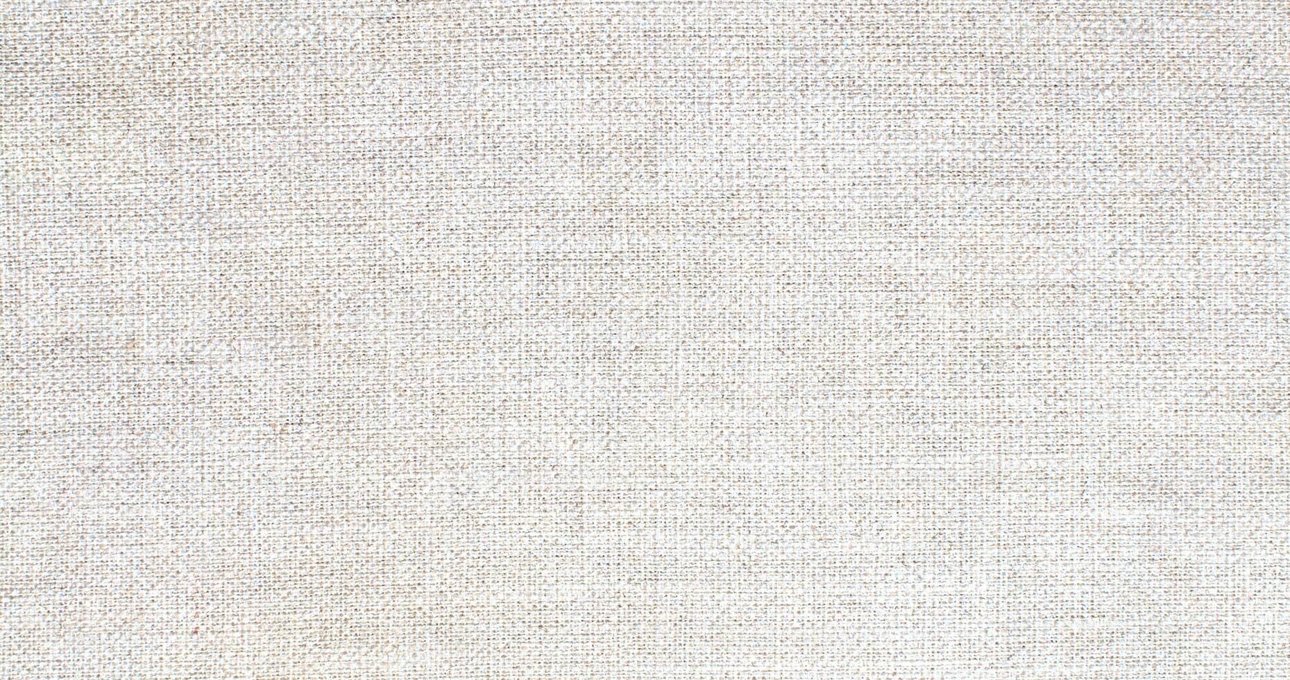 Natural Linen Material Textile Canvas Fabric Texture Background Close-up Detail of Fabric Natural Color Hemp Material Pattern Design Wallpaper. Can be Used as Background or For Graphic Design photo