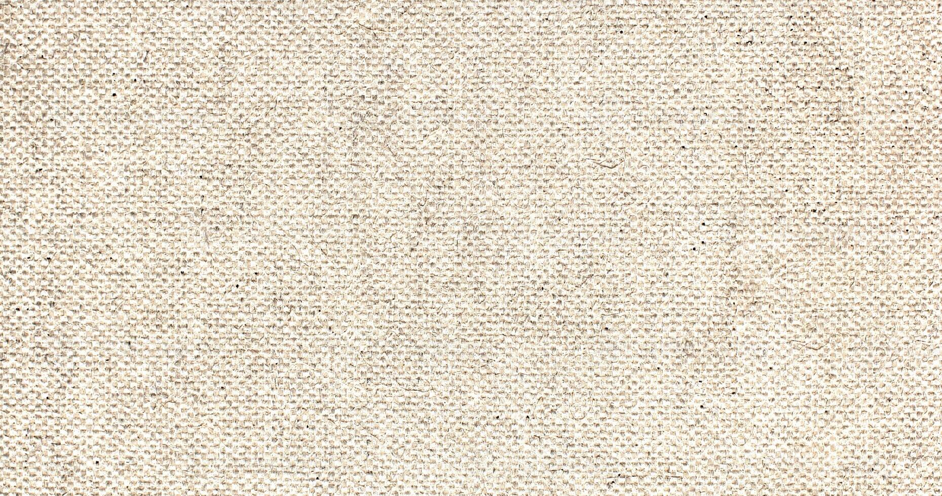 Natural Linen Material Textile Canvas Fabric Texture Background Close-up Detail of Fabric Natural Color Hemp Material Pattern Design Wallpaper. Can be Used as Background or For Graphic Design photo
