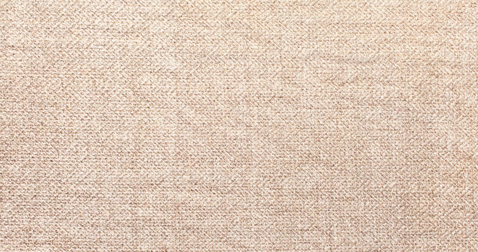 Natural Linen Material Textile Canvas Fabric Texture Background Close-up Detail of Fabric Natural Color Hemp Material Pattern Design Wallpaper. Can be Used as Background or For Graphic Design photo