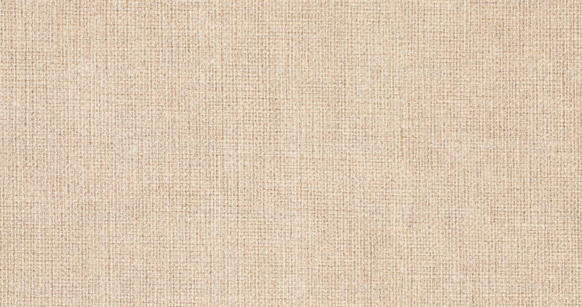 Natural Linen Material Textile Canvas Fabric Texture Background Close-up Detail of Fabric Natural Color Hemp Material Pattern Design Wallpaper. Can be Used as Background or For Graphic Design photo