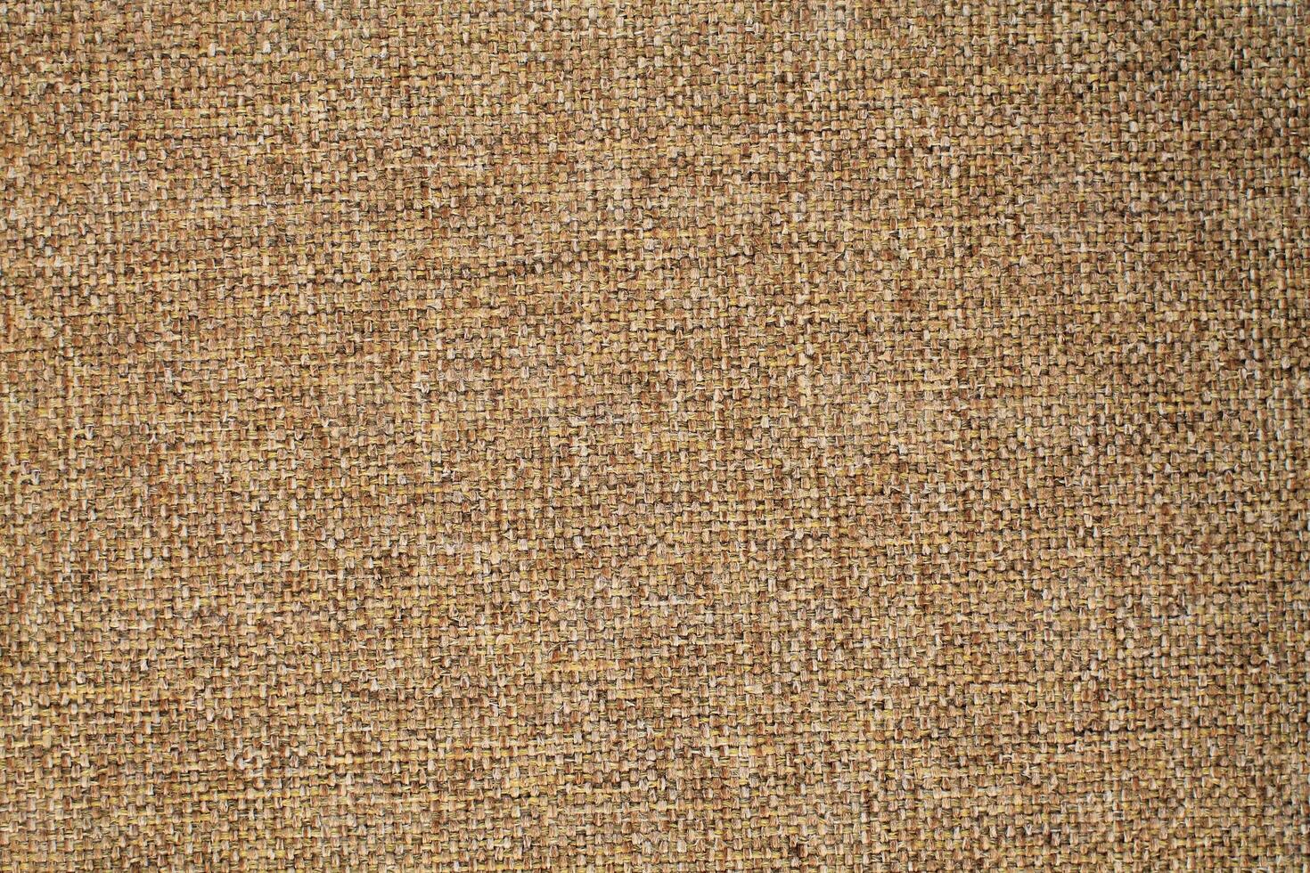 Natural Linen Material Textile Canvas Fabric Texture Background Close-up Detail of Fabric Natural Color Hemp Material Pattern Design Wallpaper. Can be Used as Background or For Graphic Design photo