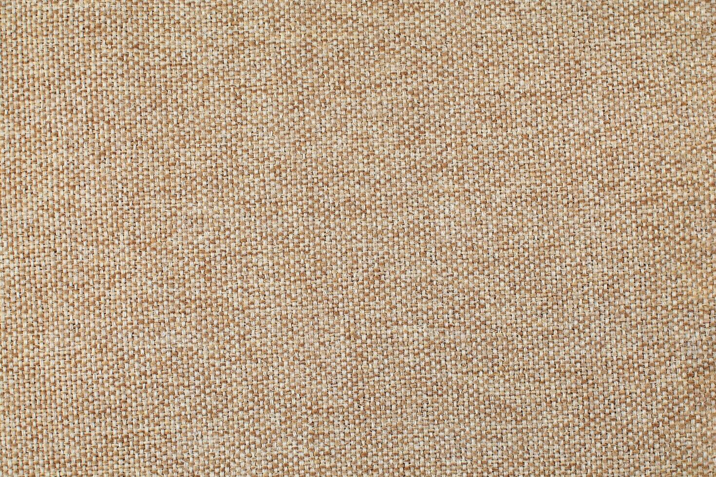 Natural Linen Material Textile Canvas Fabric Texture Background Close-up Detail of Fabric Natural Color Hemp Material Pattern Design Wallpaper. Can be Used as Background or For Graphic Design photo