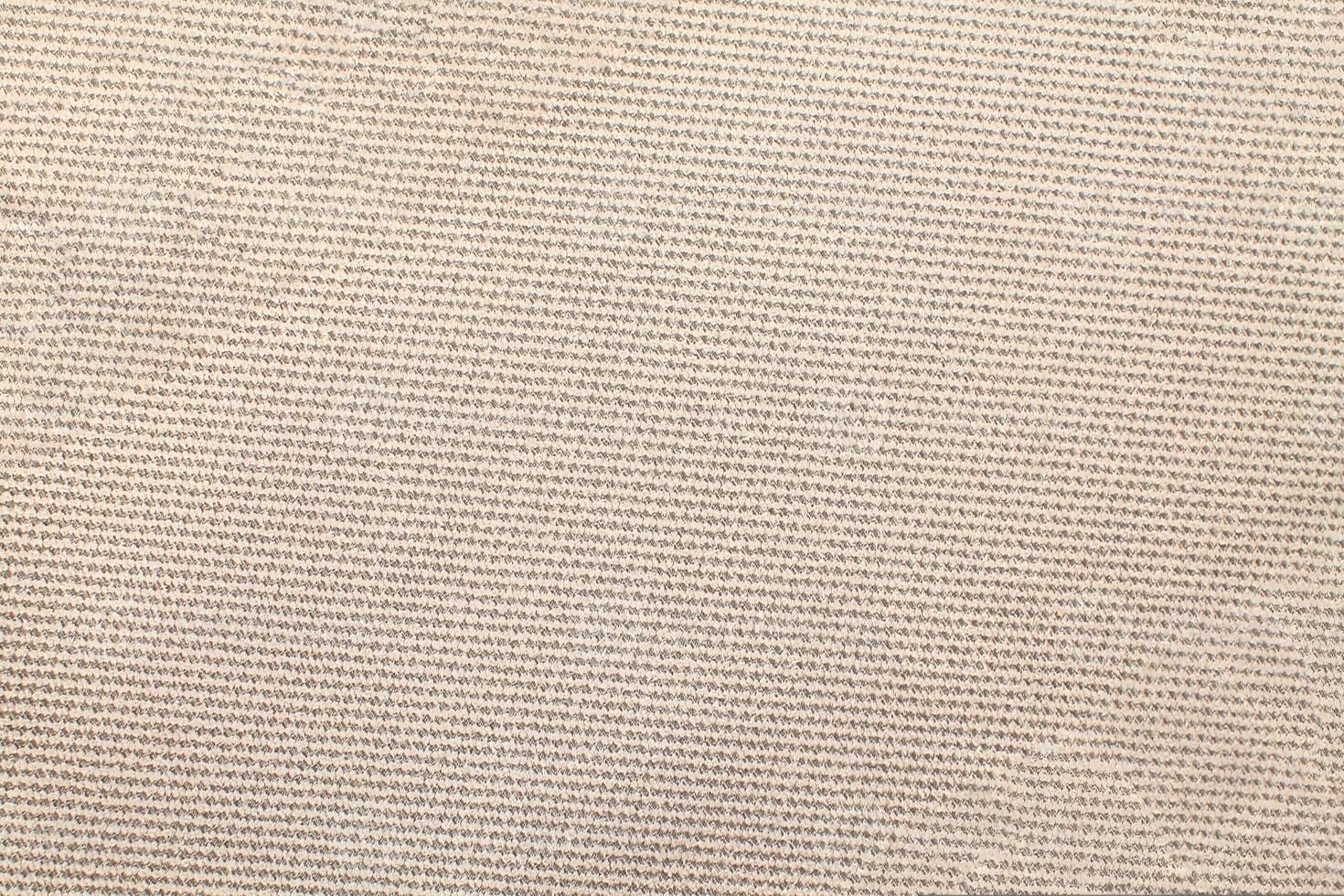 Natural Linen Material Textile Canvas Fabric Texture Background Close-up Detail of Fabric Natural Color Hemp Material Pattern Design Wallpaper. Can be Used as Background or For Graphic Design photo