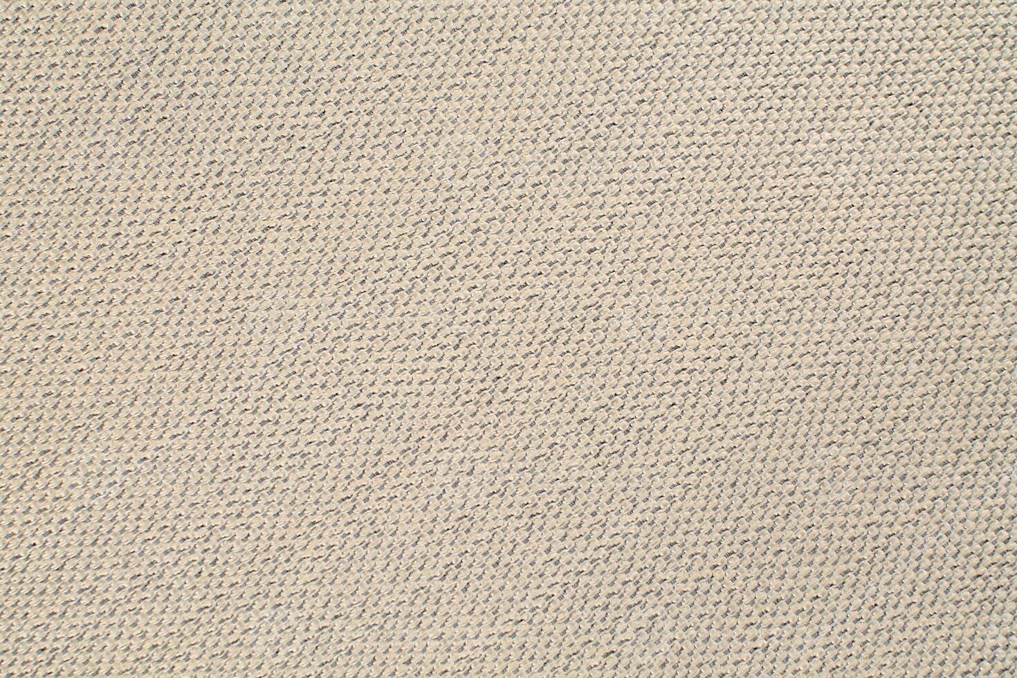 Natural Linen Material Textile Canvas Fabric Texture Background Close-up Detail of Fabric Natural Color Hemp Material Pattern Design Wallpaper. Can be Used as Background or For Graphic Design photo
