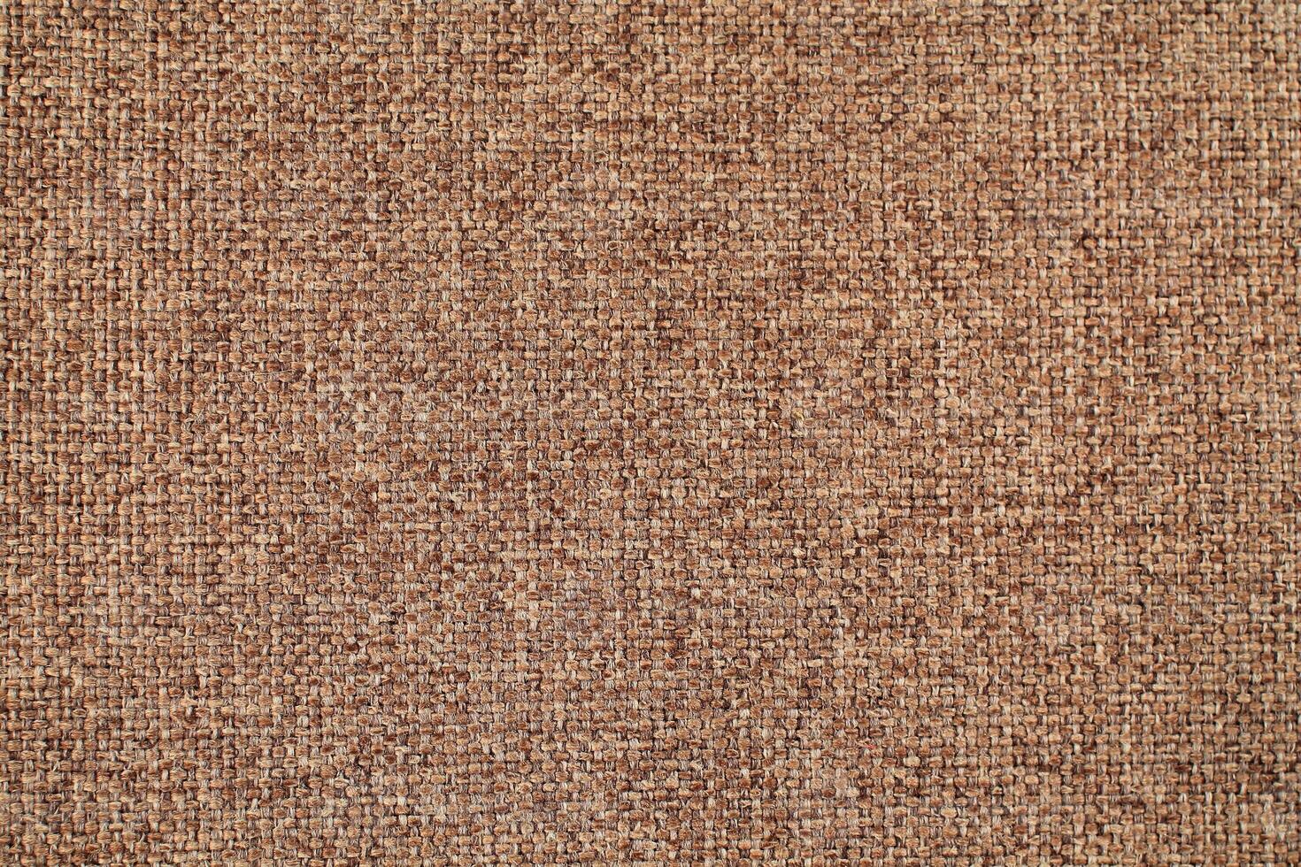 Natural Linen Material Textile Canvas Fabric Texture Background Close-up Detail of Fabric Natural Color Hemp Material Pattern Design Wallpaper. Can be Used as Background or For Graphic Design photo