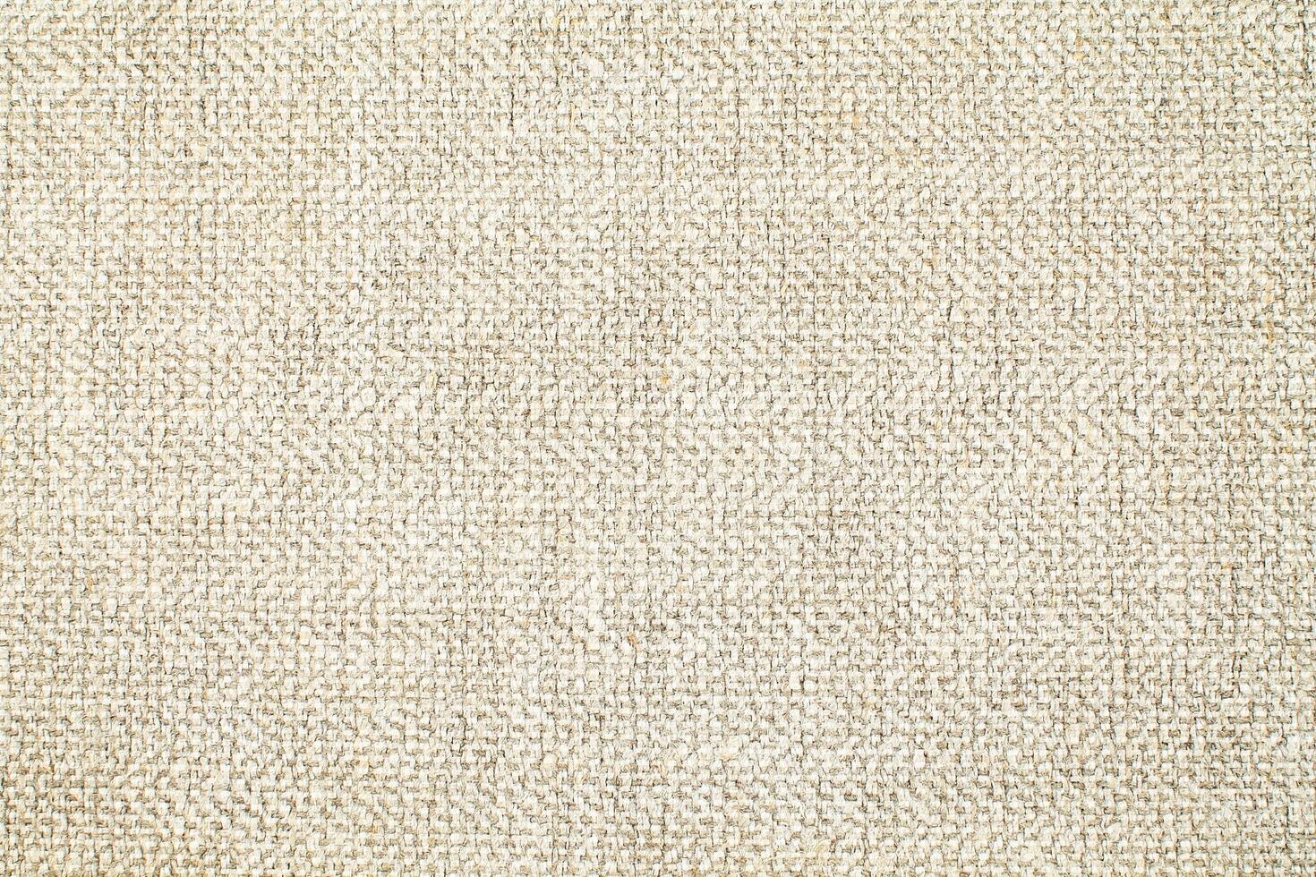 Natural Linen Material Textile Canvas Fabric Texture Background Close-up Detail of Fabric Natural Color Hemp Material Pattern Design Wallpaper. Can be Used as Background or For Graphic Design photo