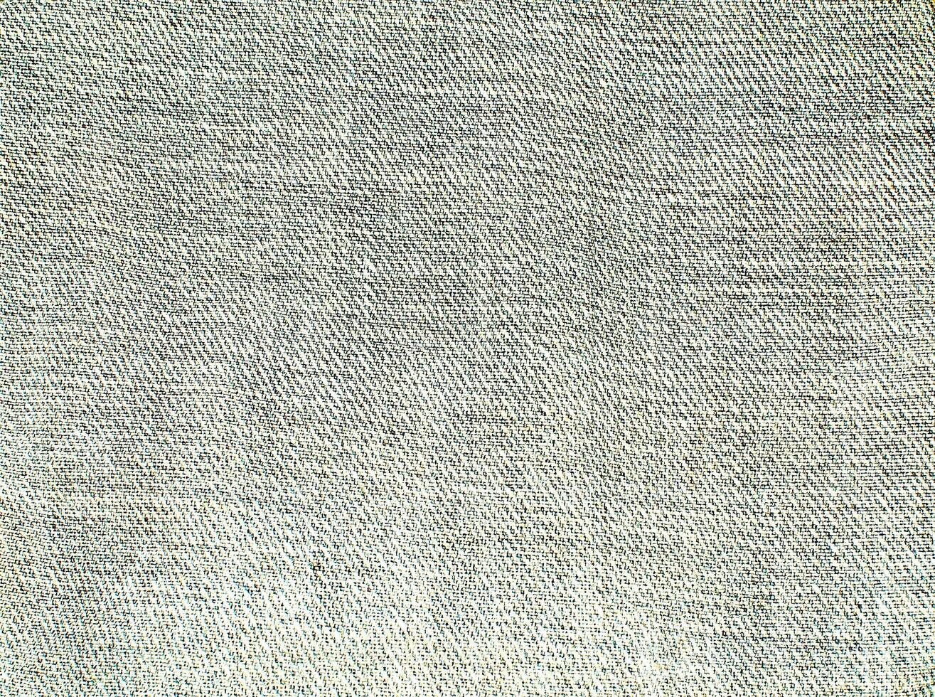 Natural Linen Material Textile Canvas Fabric Texture Background Close-up Detail of Fabric Natural Color Hemp Material Pattern Design Wallpaper. Can be Used as Background or For Graphic Design photo