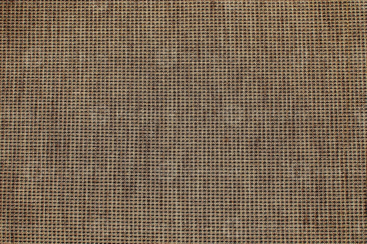 Natural Linen Material Textile Canvas Fabric Texture Background Close-up Detail of Fabric Natural Color Hemp Material Pattern Design Wallpaper. Can be Used as Background or For Graphic Design photo