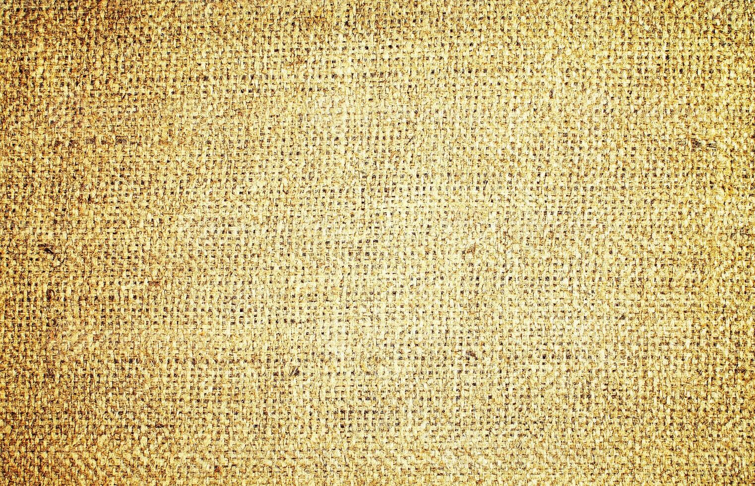 Natural Linen Material Textile Canvas Fabric Texture Background Close-up Detail of Fabric Natural Color Hemp Material Pattern Design Wallpaper. Can be Used as Background or For Graphic Design photo