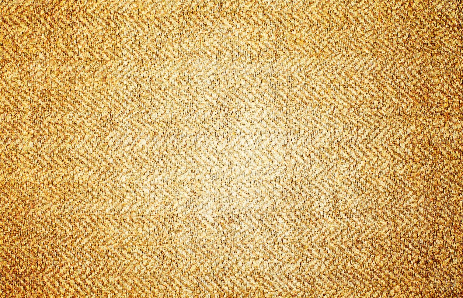 Natural Linen Material Textile Canvas Fabric Texture Background Close-up Detail of Fabric Natural Color Hemp Material Pattern Design Wallpaper. Can be Used as Background or For Graphic Design photo