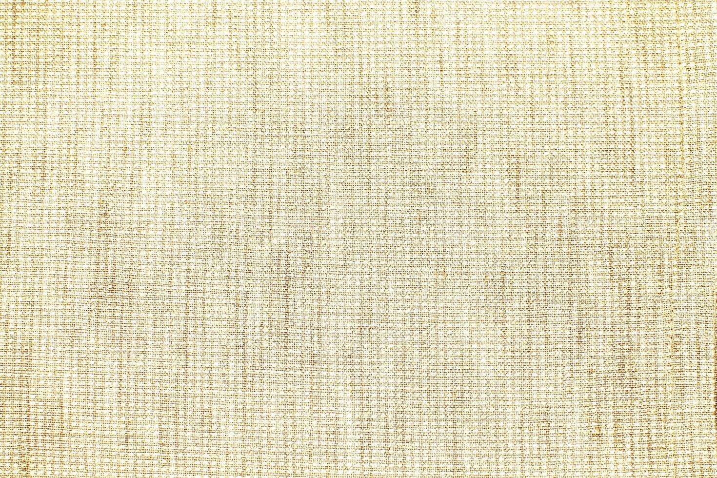 Natural Linen Material Textile Canvas Fabric Texture Background Close-up Detail of Fabric Natural Color Hemp Material Pattern Design Wallpaper. Can be Used as Background or For Graphic Design photo