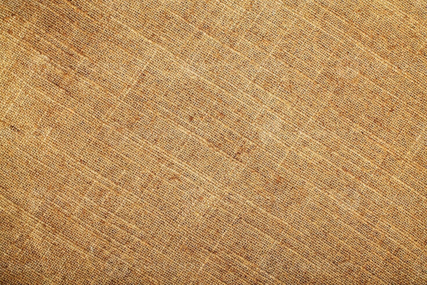 Natural Linen Material Textile Canvas Fabric Texture Background Close-up Detail of Fabric Natural Color Hemp Material Pattern Design Wallpaper. Can be Used as Background or For Graphic Design photo