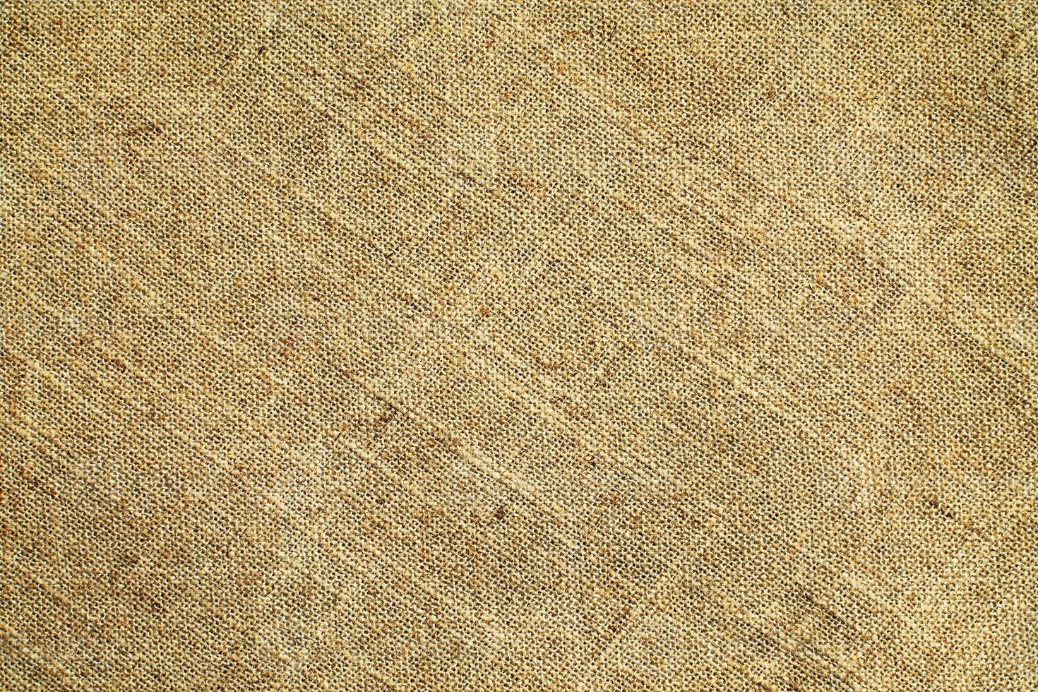 Natural Linen Material Textile Canvas Fabric Texture Background Close-up Detail of Fabric Natural Color Hemp Material Pattern Design Wallpaper. Can be Used as Background or For Graphic Design photo