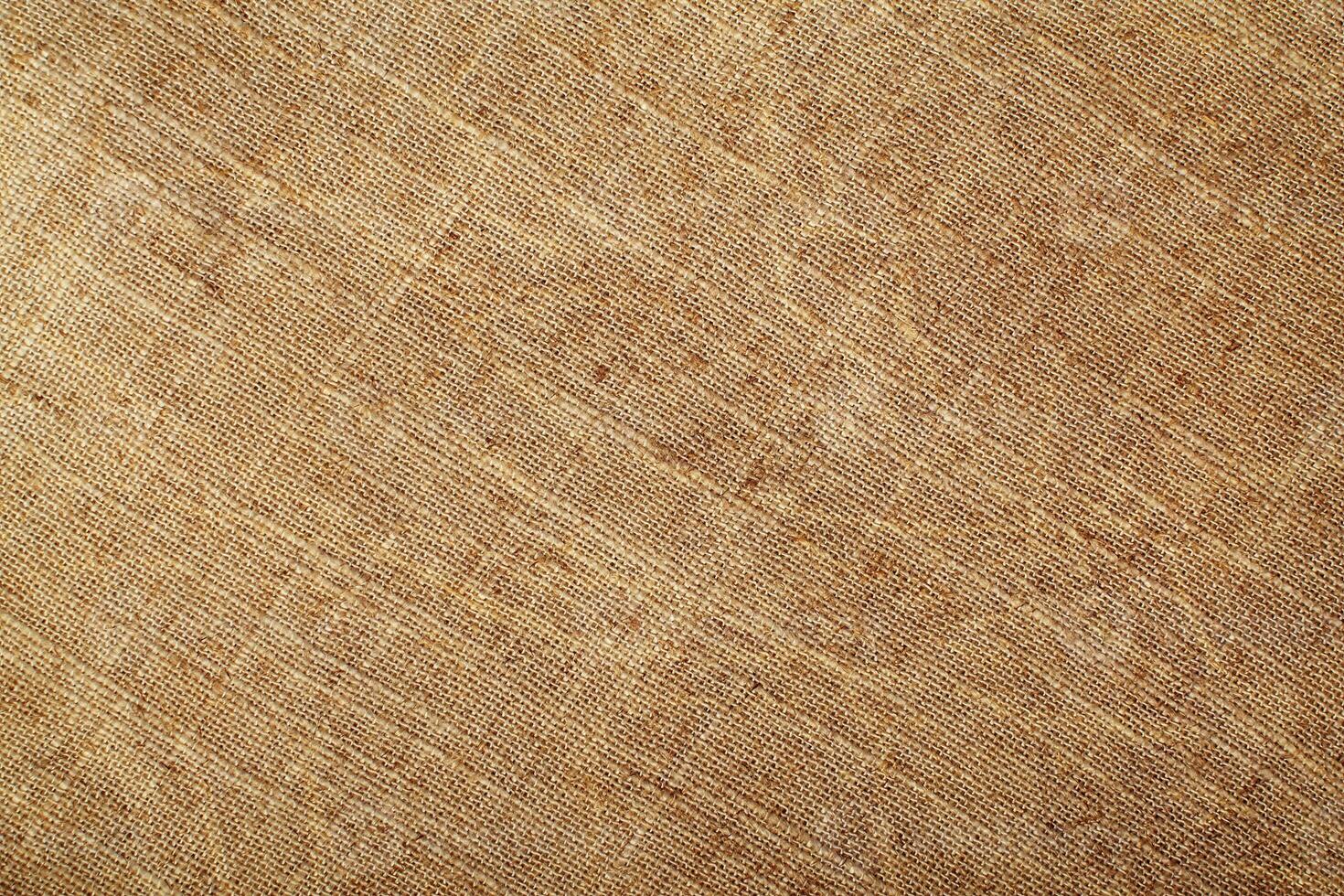 Natural Linen Material Textile Canvas Fabric Texture Background Close-up Detail of Fabric Natural Color Hemp Material Pattern Design Wallpaper. Can be Used as Background or For Graphic Design photo