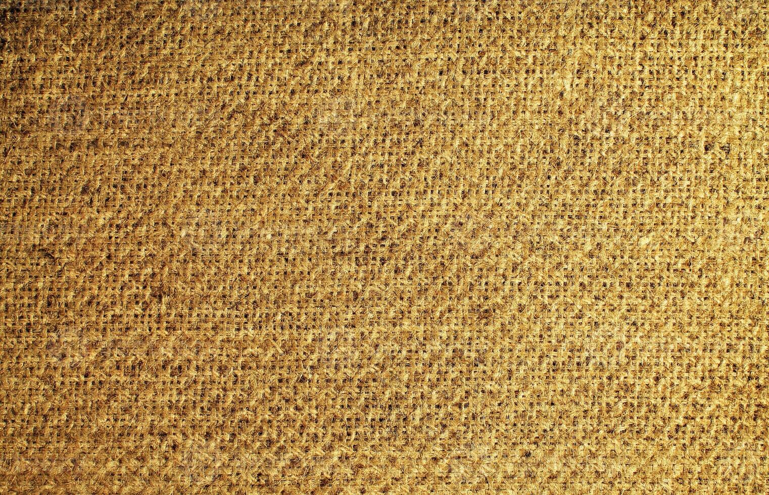 Natural Linen Material Textile Canvas Fabric Texture Background Close-up Detail of Fabric Natural Color Hemp Material Pattern Design Wallpaper. Can be Used as Background or For Graphic Design photo
