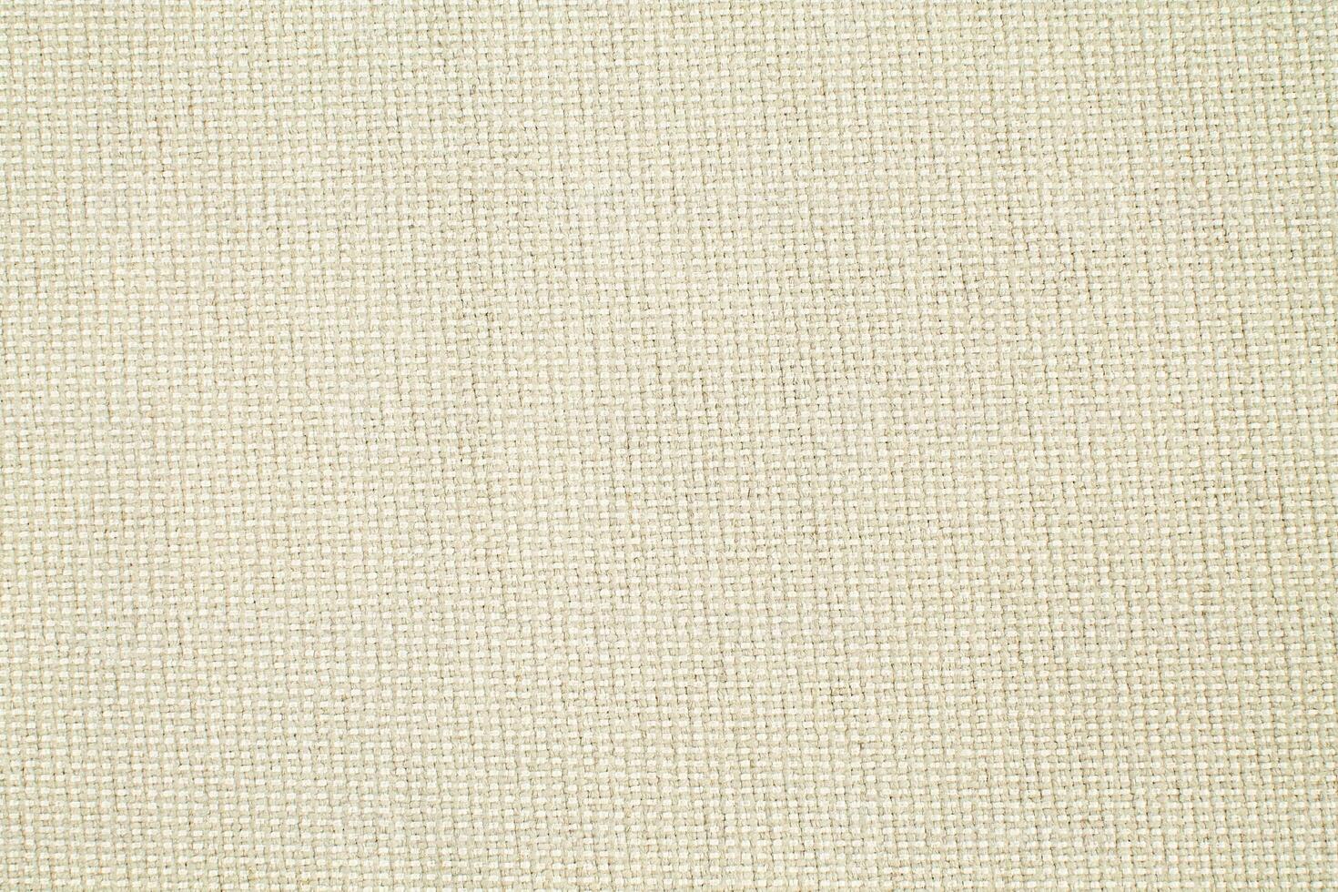 Natural Linen Material Textile Canvas Fabric Texture Background Close-up Detail of Fabric Natural Color Hemp Material Pattern Design Wallpaper. Can be Used as Background or For Graphic Design photo