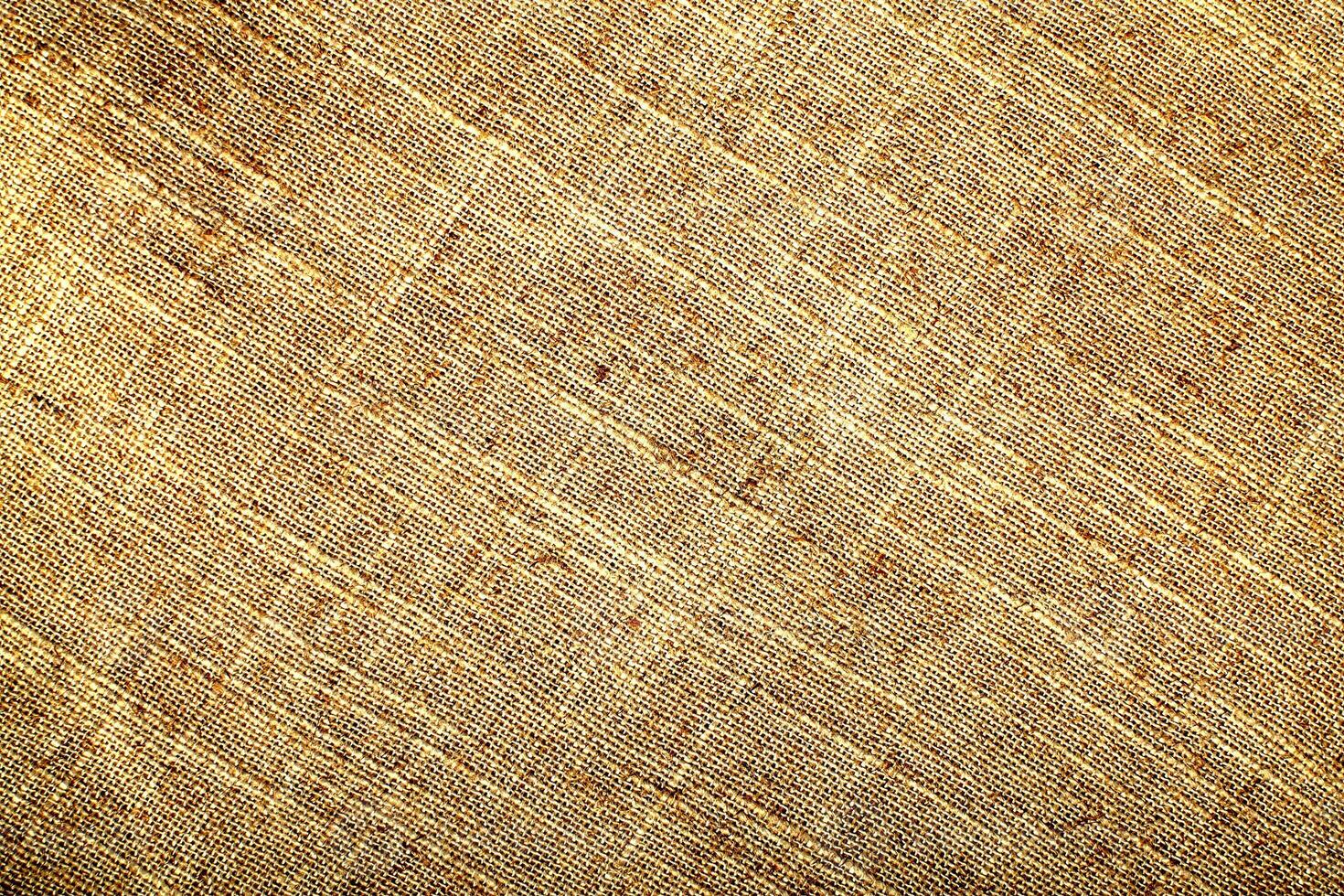 Natural Linen Material Textile Canvas Fabric Texture Background Close-up Detail of Fabric Natural Color Hemp Material Pattern Design Wallpaper. Can be Used as Background or For Graphic Design photo