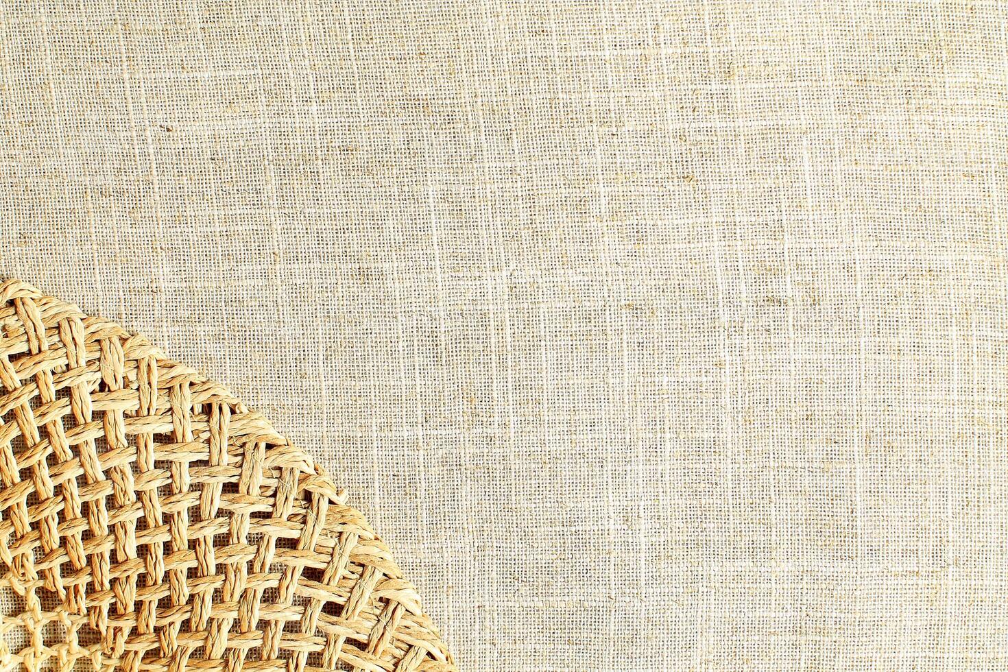 Natural Linen Material Textile Canvas Fabric Texture Background Close-up Detail of Fabric Natural Color Hemp Material Pattern Design Wallpaper. Can be Used as Background or For Graphic Design photo