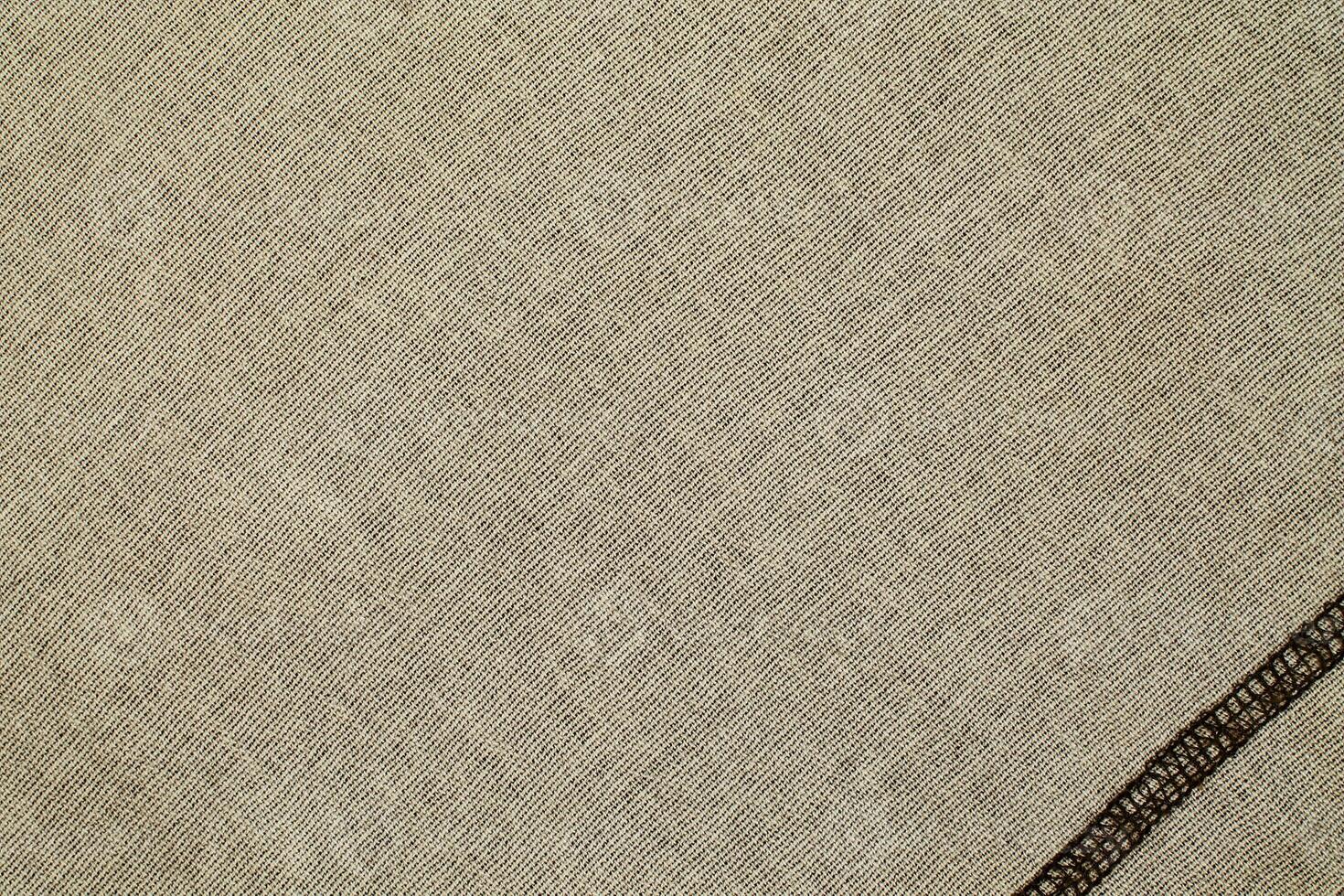 Natural Linen Material Textile Canvas Fabric Texture Background Close-up Detail of Fabric Natural Color Hemp Material Pattern Design Wallpaper. Can be Used as Background or For Graphic Design photo