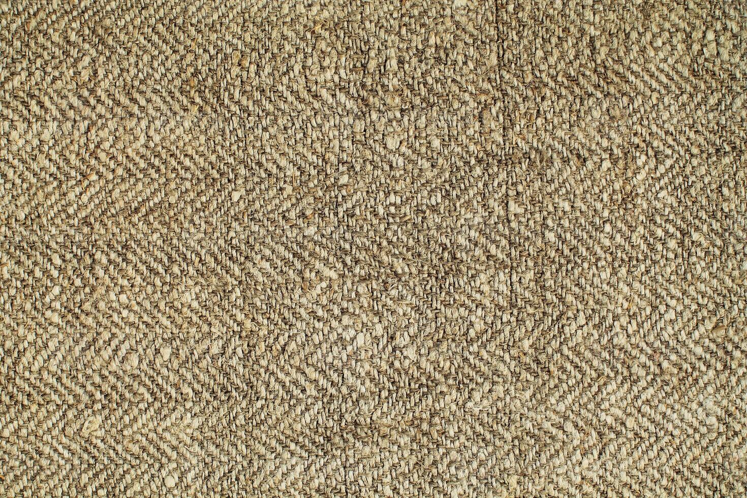Natural Linen Material Textile Canvas Fabric Texture Background Close-up Detail of Fabric Natural Color Hemp Material Pattern Design Wallpaper. Can be Used as Background or For Graphic Design photo