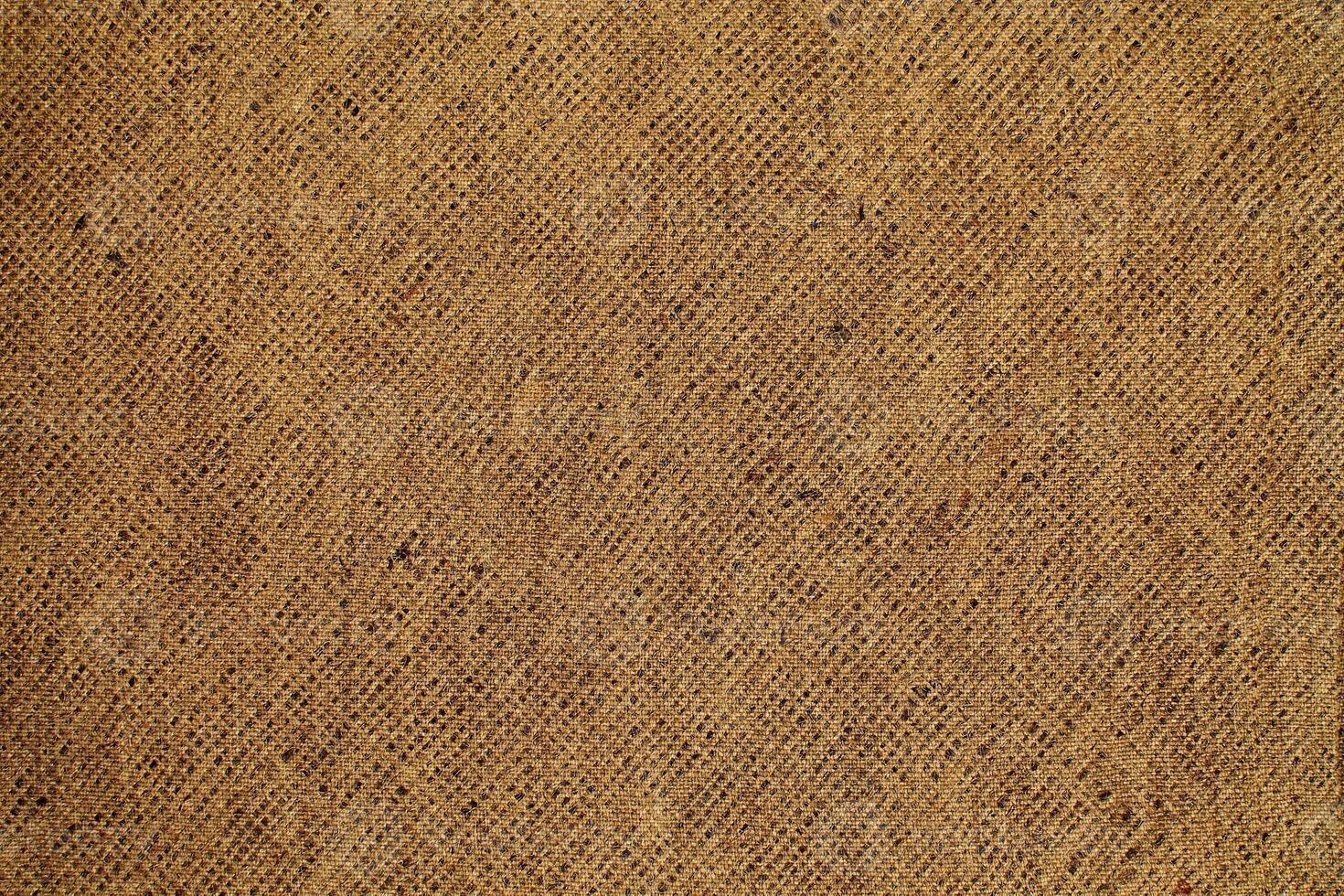 Natural Linen Material Textile Canvas Fabric Texture Background Close-up Detail of Fabric Natural Color Hemp Material Pattern Design Wallpaper. Can be Used as Background or For Graphic Design photo