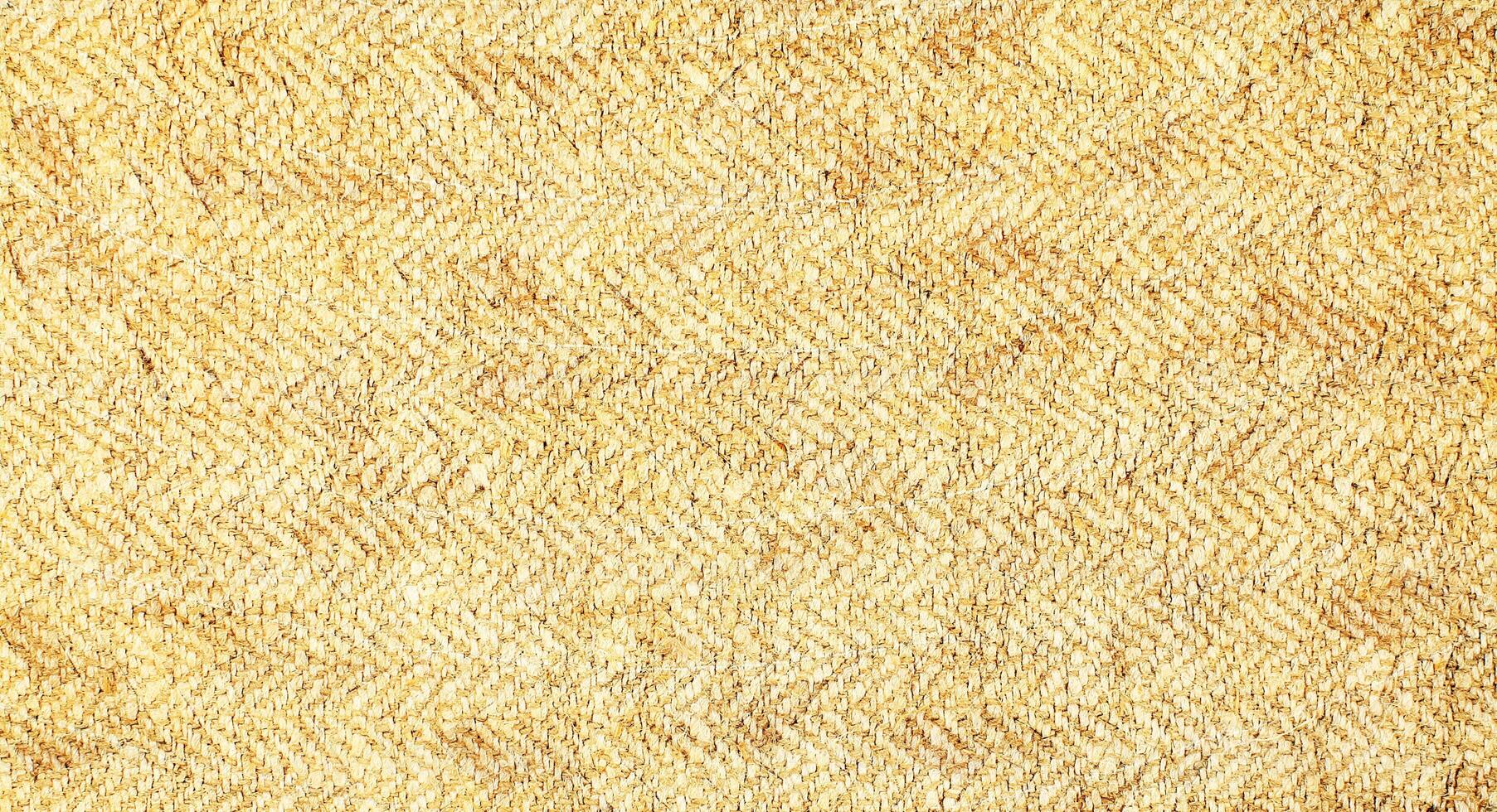 Natural Linen Material Textile Canvas Fabric Texture Background Close-up Detail of Fabric Natural Color Hemp Material Pattern Design Wallpaper. Can be Used as Background or For Graphic Design photo