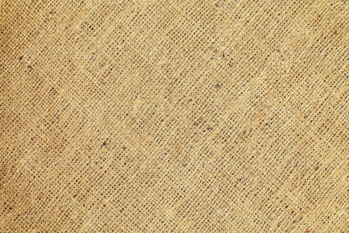Natural Linen Material Textile Canvas Fabric Texture Background Close-up Detail of Fabric Natural Color Hemp Material Pattern Design Wallpaper. Can be Used as Background or For Graphic Design photo