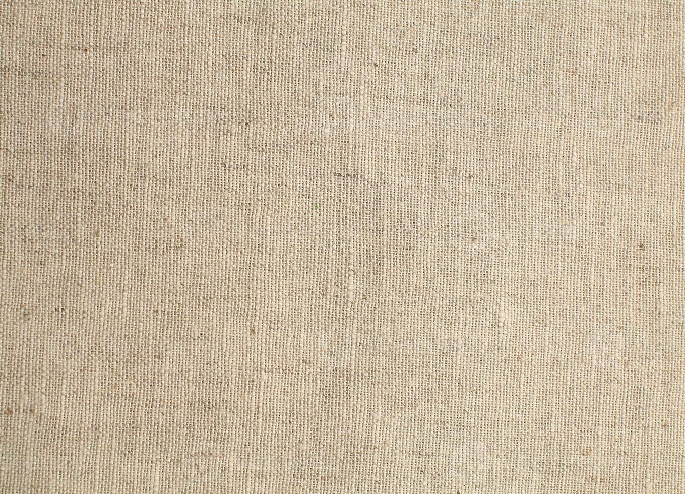 Natural Linen Material Textile Canvas Fabric Texture Background Close-up Detail of Fabric Natural Color Hemp Material Pattern Design Wallpaper. Can be Used as Background or For Graphic Design photo