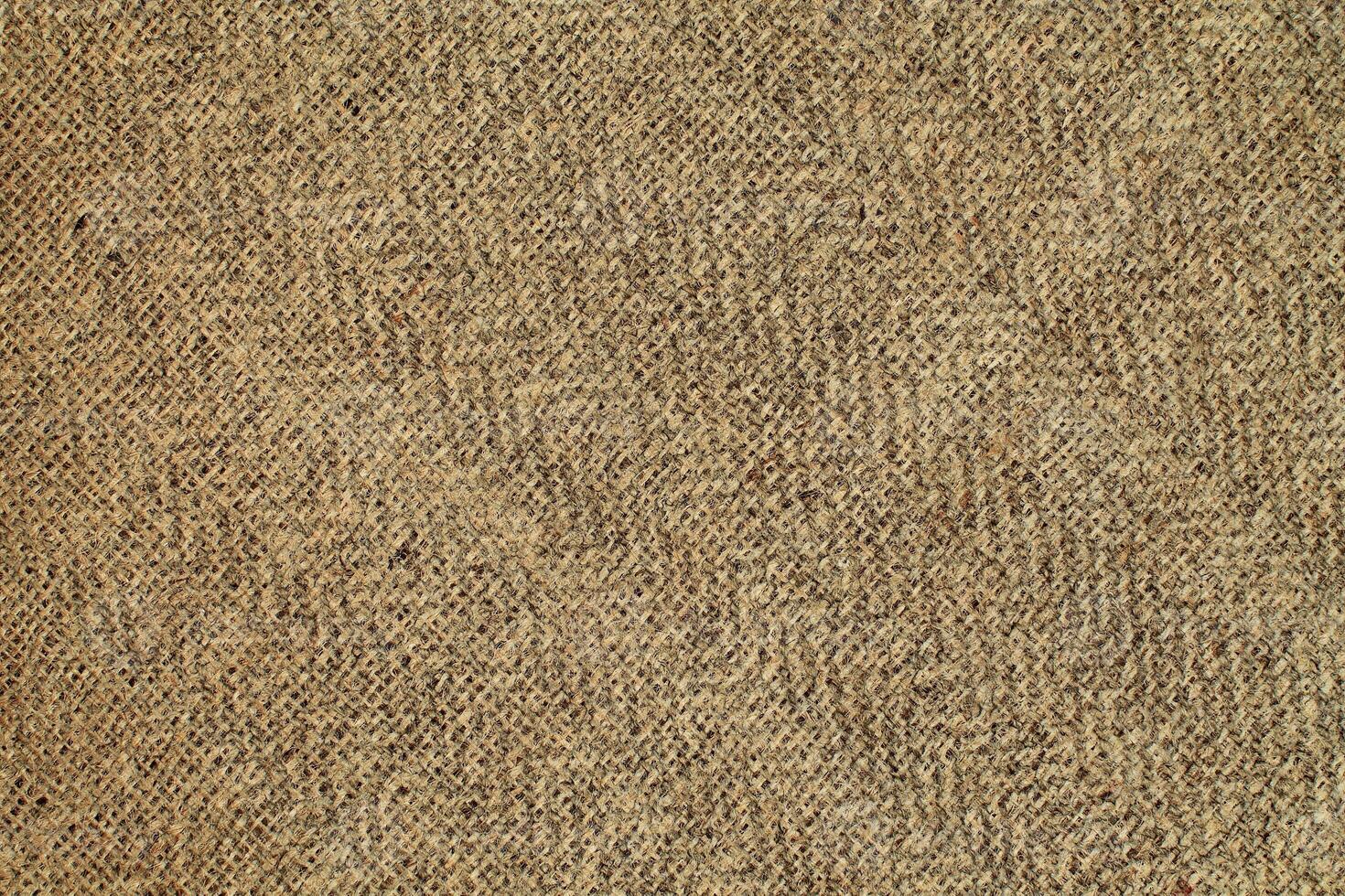 Natural Linen Material Textile Canvas Fabric Texture Background Close-up Detail of Fabric Natural Color Hemp Material Pattern Design Wallpaper. Can be Used as Background or For Graphic Design photo