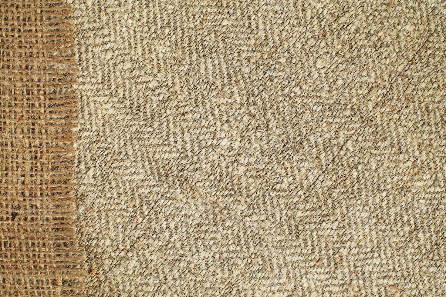 Natural Linen Material Textile Canvas Fabric Texture Background Close-up Detail of Fabric Natural Color Hemp Material Pattern Design Wallpaper. Can be Used as Background or For Graphic Design photo