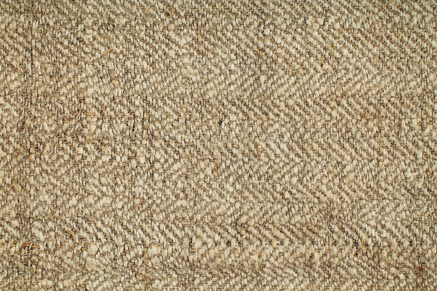 Natural Linen Material Textile Canvas Fabric Texture Background Close-up Detail of Fabric Natural Color Hemp Material Pattern Design Wallpaper. Can be Used as Background or For Graphic Design photo