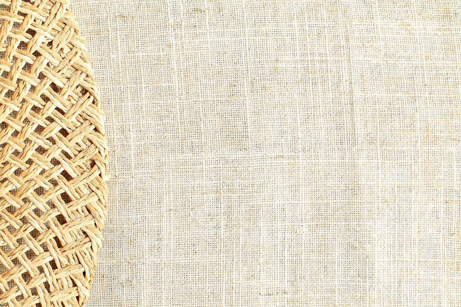 Natural Linen Material Textile Canvas Fabric Texture Background Close-up Detail of Fabric Natural Color Hemp Material Pattern Design Wallpaper. Can be Used as Background or For Graphic Design photo