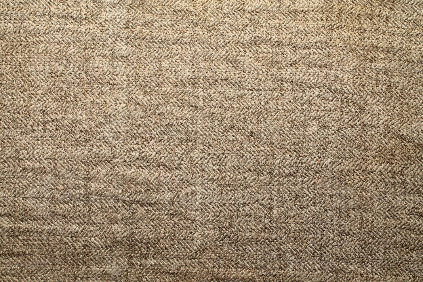 Natural Linen Material Textile Canvas Fabric Texture Background Close-up Detail of Fabric Natural Color Hemp Material Pattern Design Wallpaper. Can be Used as Background or For Graphic Design photo