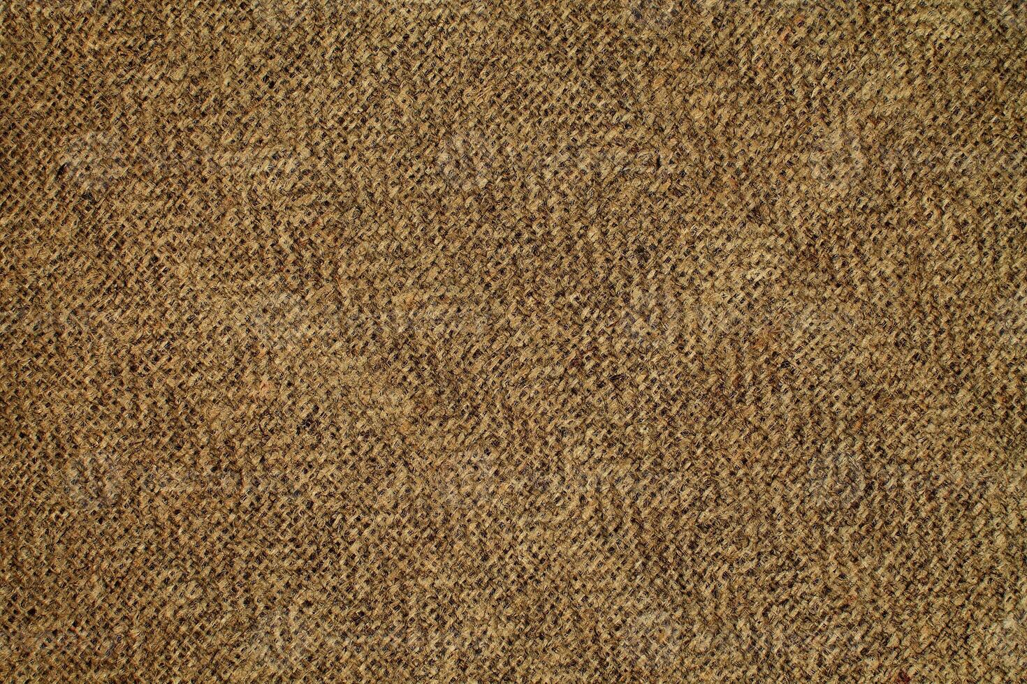 Natural Linen Material Textile Canvas Fabric Texture Background Close-up Detail of Fabric Natural Color Hemp Material Pattern Design Wallpaper. Can be Used as Background or For Graphic Design photo