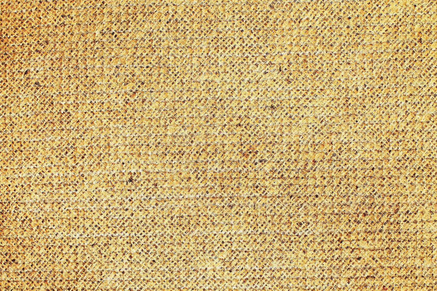 Natural Linen Material Textile Canvas Fabric Texture Background Close-up Detail of Fabric Natural Color Hemp Material Pattern Design Wallpaper. Can be Used as Background or For Graphic Design photo