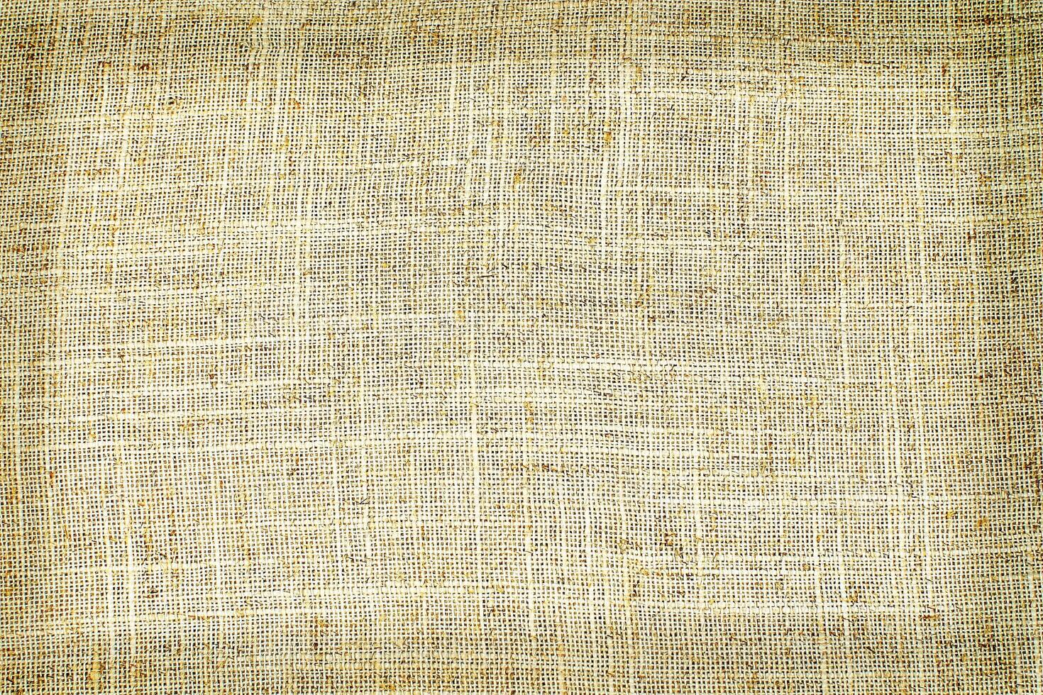 Natural Linen Material Textile Canvas Fabric Texture Background Close-up Detail of Fabric Natural Color Hemp Material Pattern Design Wallpaper. Can be Used as Background or For Graphic Design photo