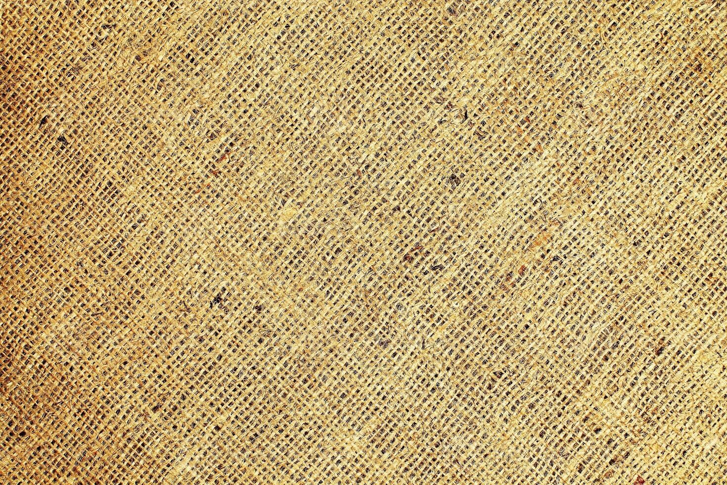 Natural Linen Material Textile Canvas Fabric Texture Background Close-up Detail of Fabric Natural Color Hemp Material Pattern Design Wallpaper. Can be Used as Background or For Graphic Design photo