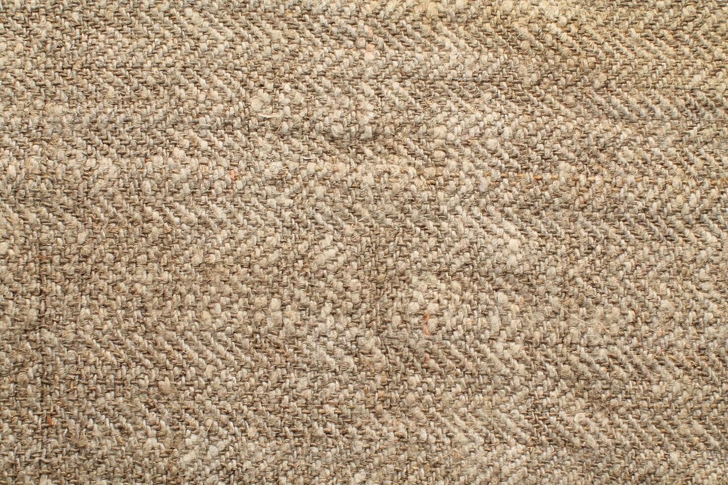 Natural Linen Material Textile Canvas Fabric Texture Background Close-up Detail of Fabric Natural Color Hemp Material Pattern Design Wallpaper. Can be Used as Background or For Graphic Design photo