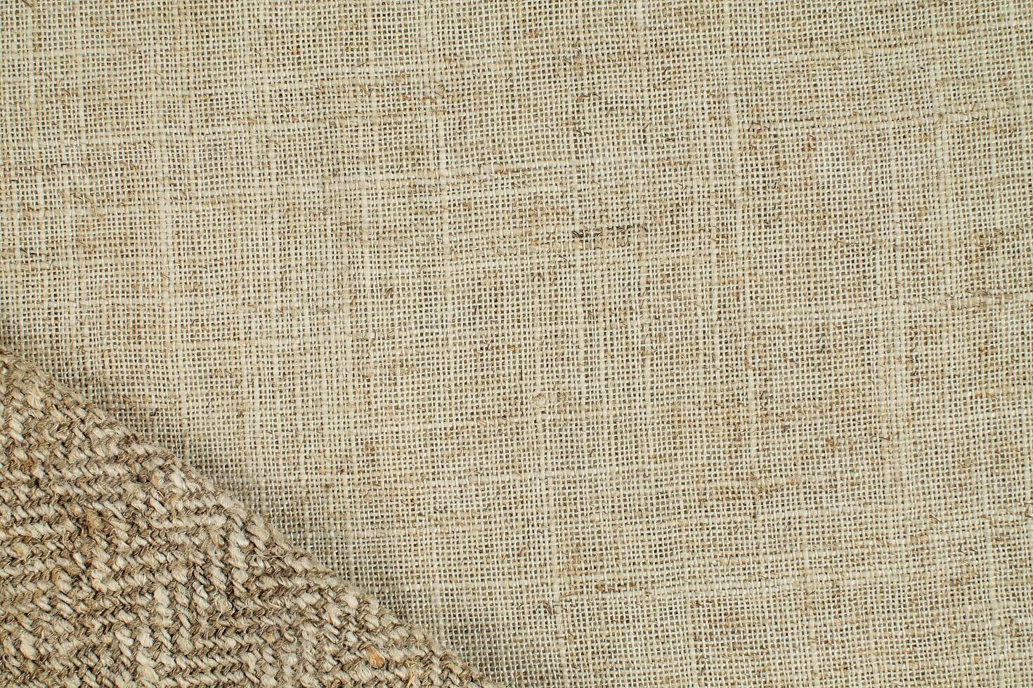 Natural Linen Material Textile Canvas Fabric Texture Background Close-up Detail of Fabric Natural Color Hemp Material Pattern Design Wallpaper. Can be Used as Background or For Graphic Design photo